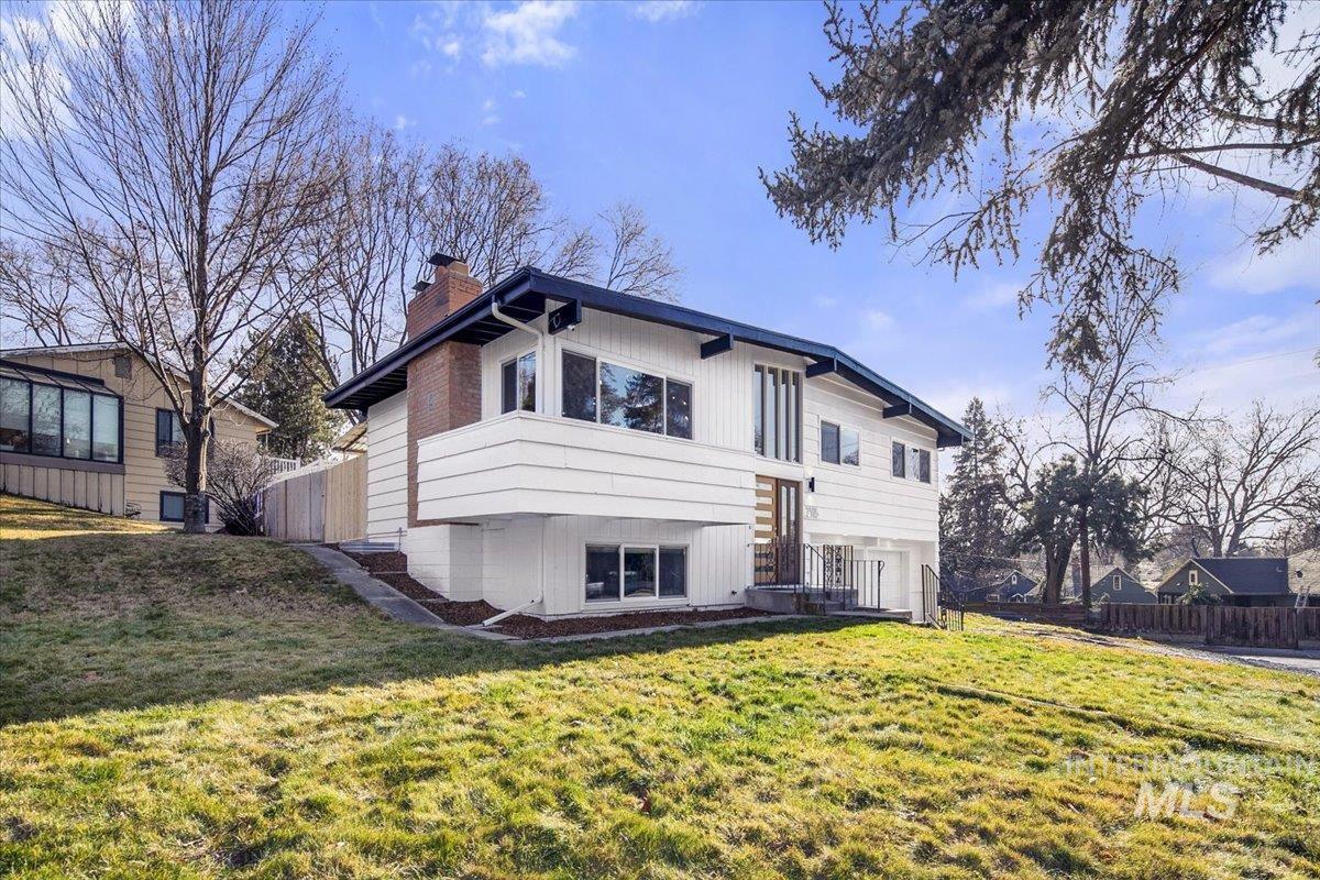 2518 Lancaster Drive Boise, ID 83702 - Photo 4 of 41 Back of property with a chimney and a patio