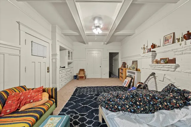 a bedroom with furniture and a chandelier