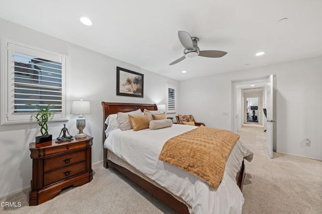 a bedroom with a bed and a tv