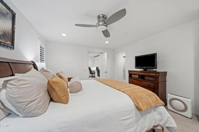 a bathroom with a bathtub double vanity sink and a shower
