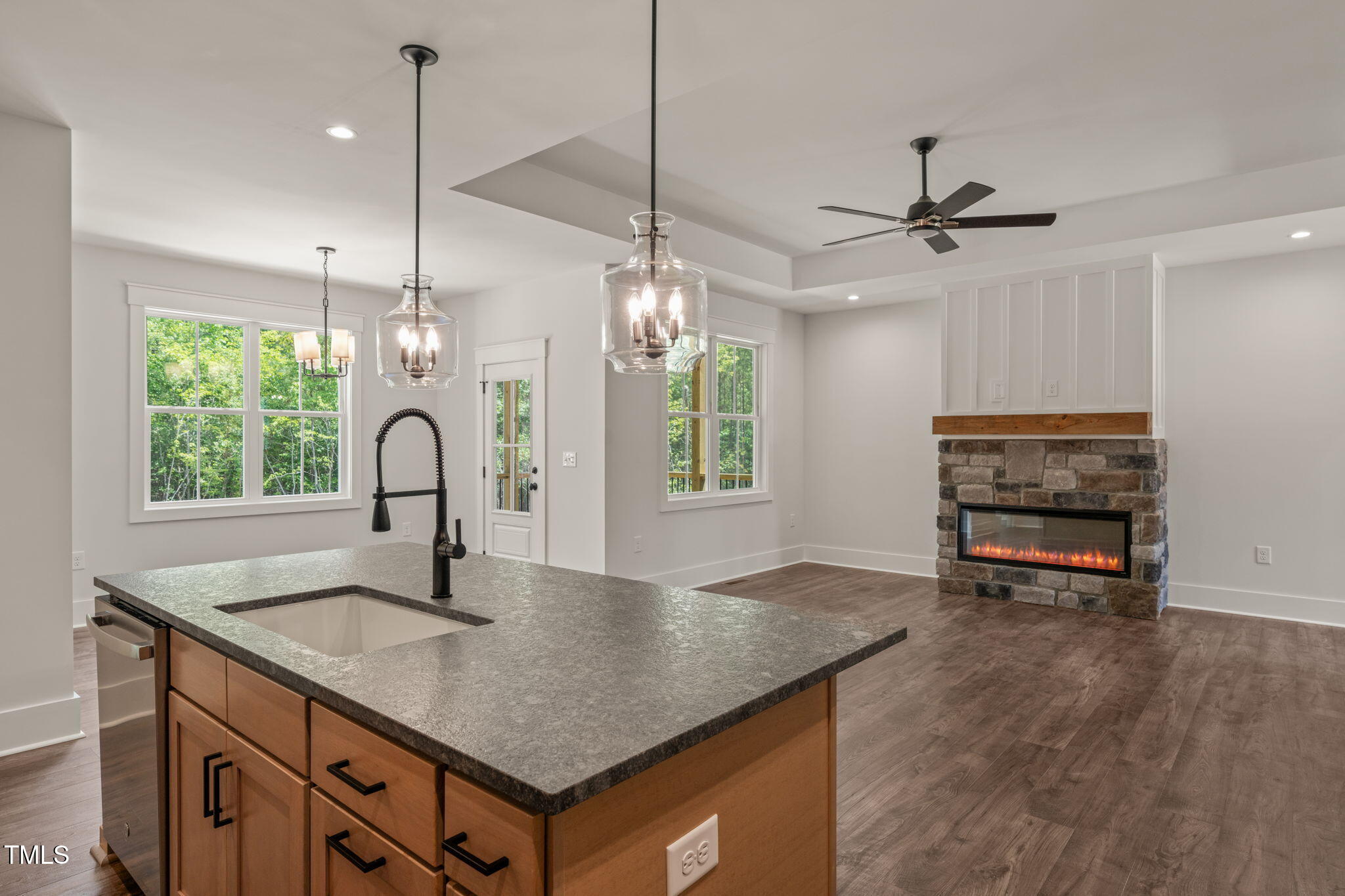 390 Pilot Ridge Road Zebulon, NC 27597 - Photo 11 of 41 a kitchen with kitchen island a counter space a sink appliances and a window