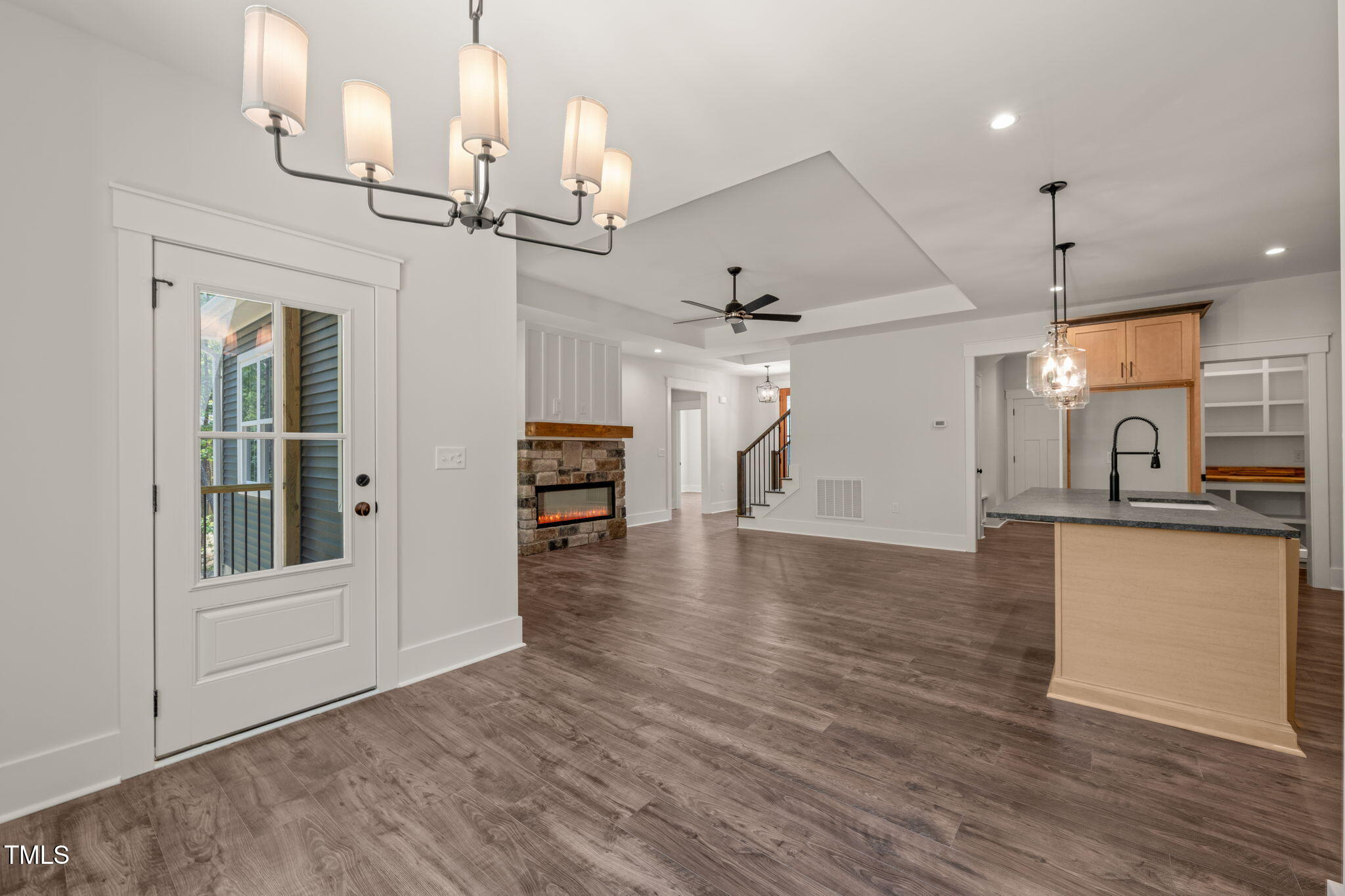 390 Pilot Ridge Road Zebulon, NC 27597 - Photo 15 of 41 an empty room with wooden floor and windows