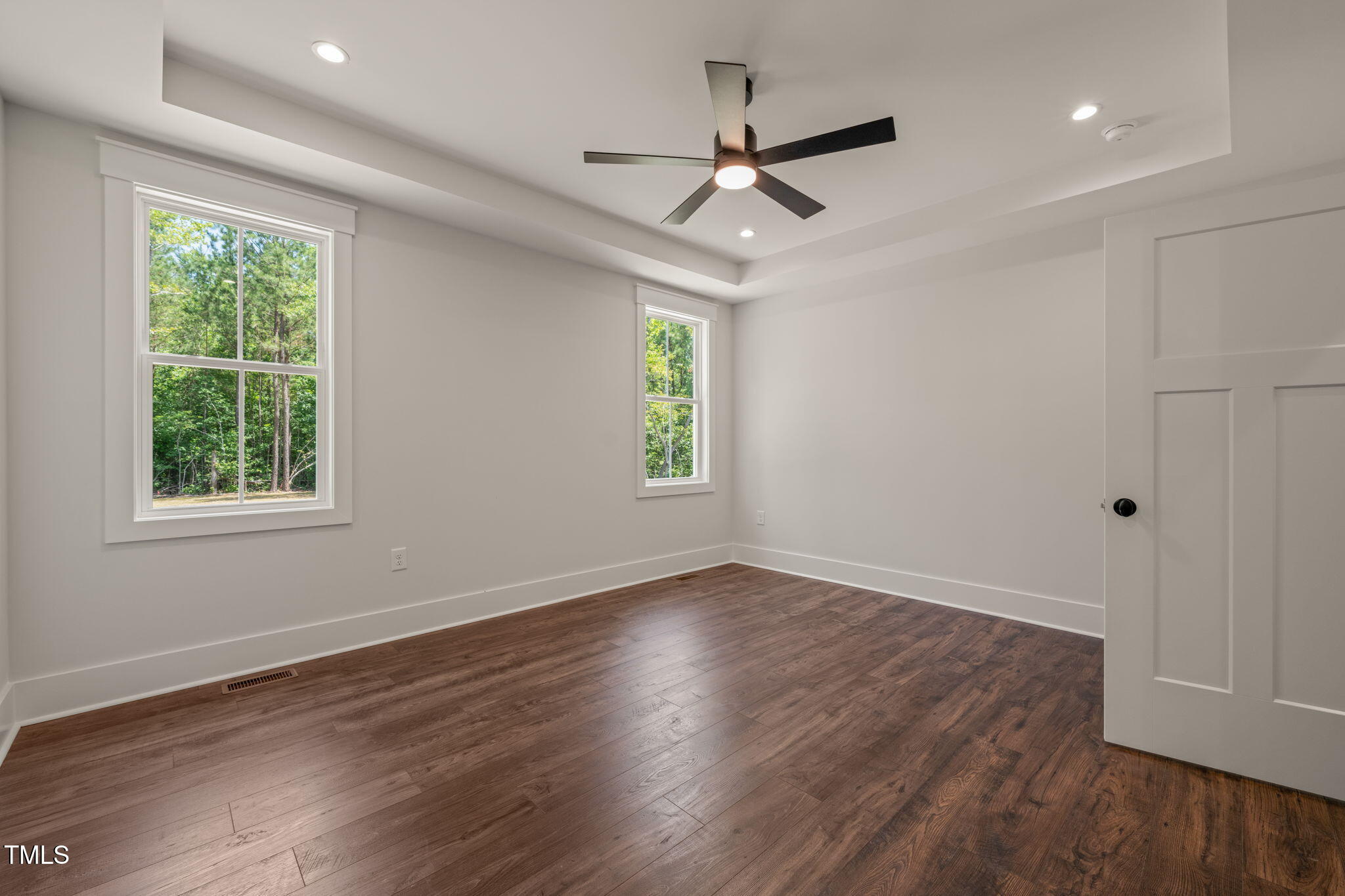 390 Pilot Ridge Road Zebulon, NC 27597 - Photo 17 of 41 a view of an empty room with wooden floor and a window