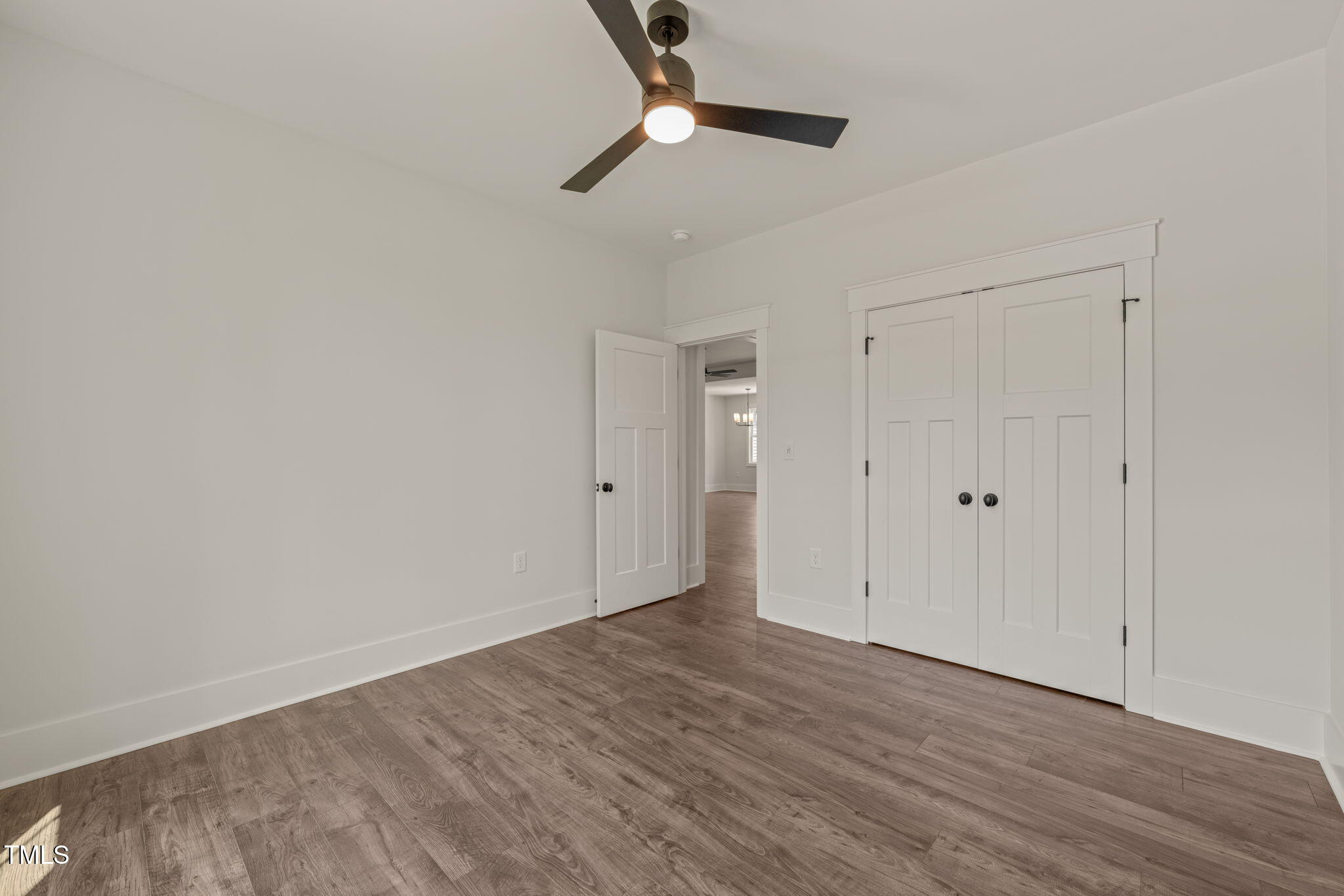390 Pilot Ridge Road Zebulon, NC 27597 - Photo 25 of 41 a view of an empty room with wooden floor