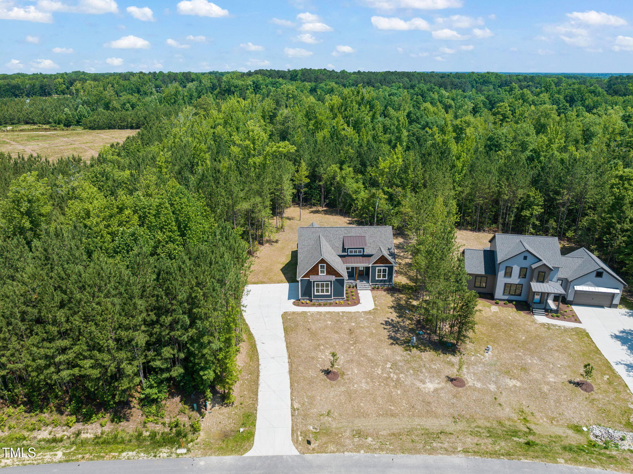 390 Pilot Ridge Road Zebulon, NC 27597 - Photo 39 of 41 an aerial view of a house with a yard and lake view