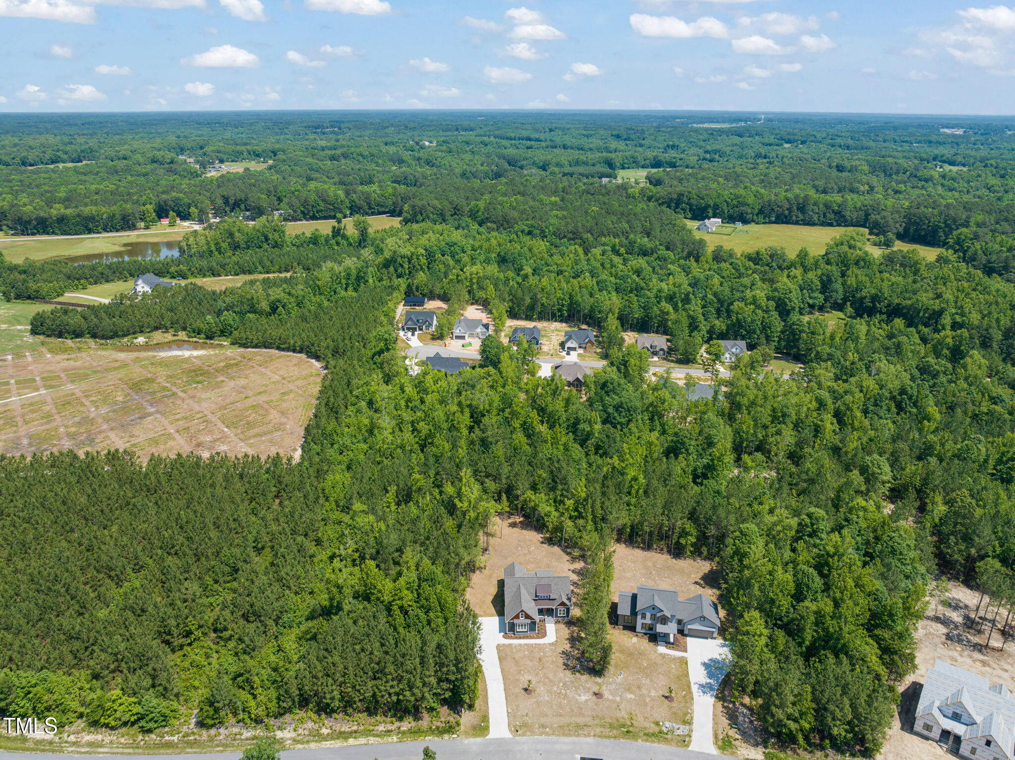 390 Pilot Ridge Road Zebulon, NC 27597 - Photo 40 of 41 an aerial view of residential houses with outdoor space and trees