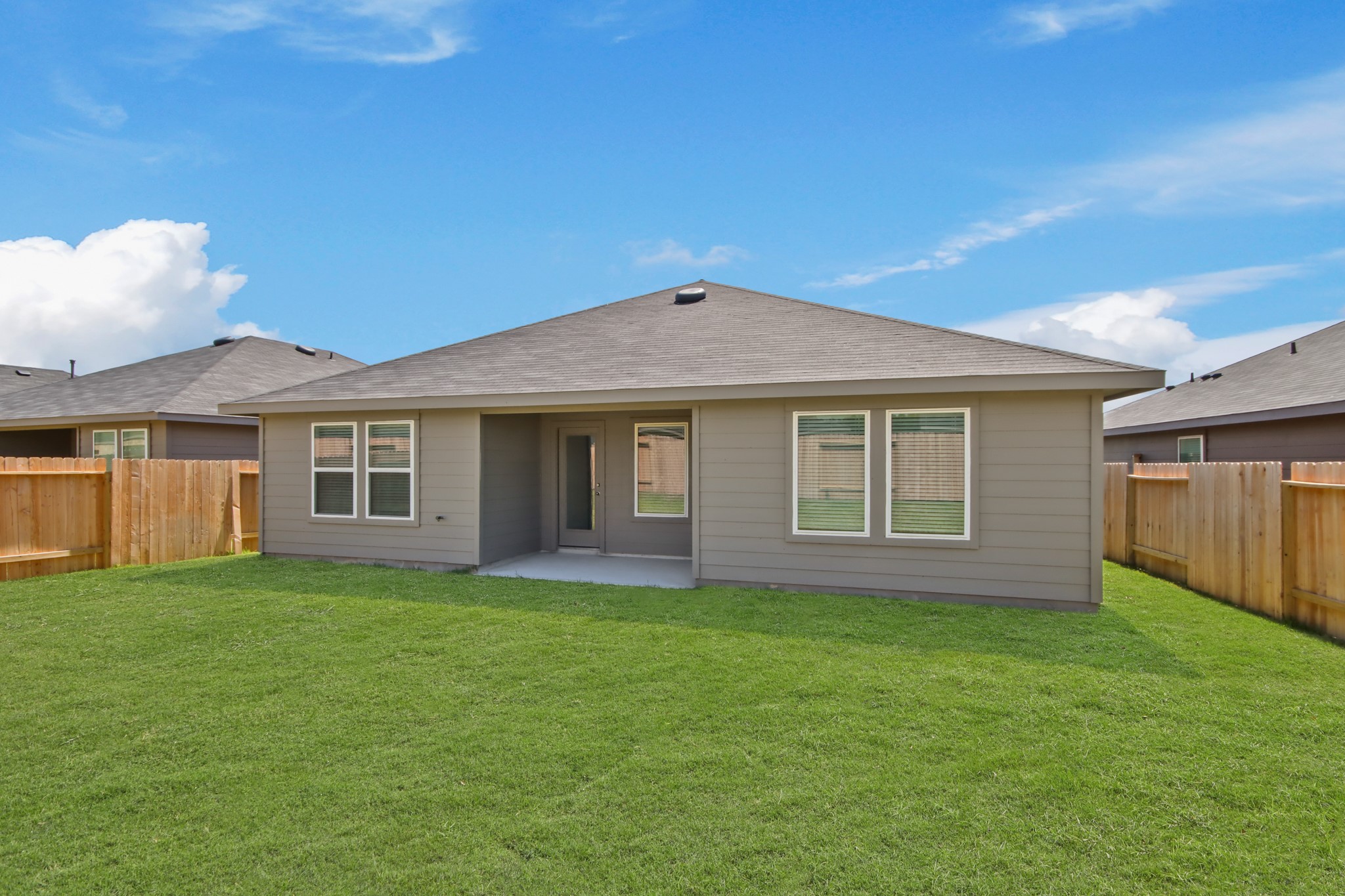 14376 Oceanblue Way Splendora, TX 77372 - Photo 15 of 21 a front view of a house with a garden