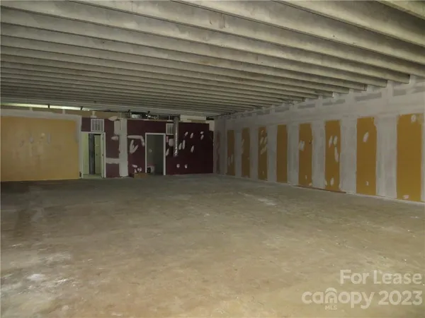 a view of a room with wooden ceiling