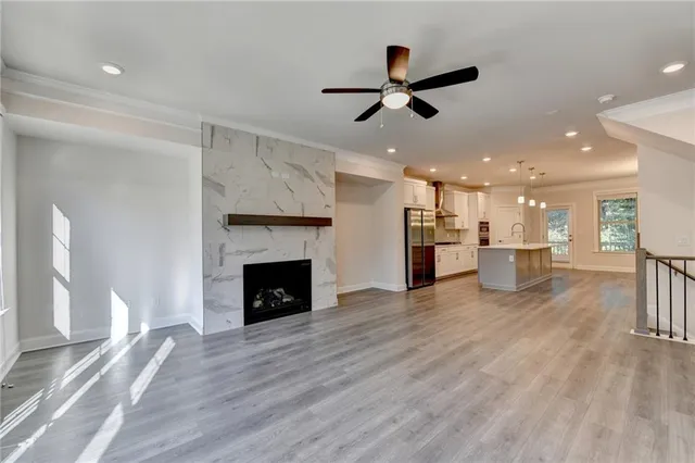 a view of a room with kitchen and fireplace