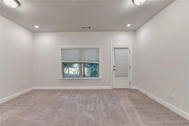 a bathroom with a sink toilet a mirror and shower