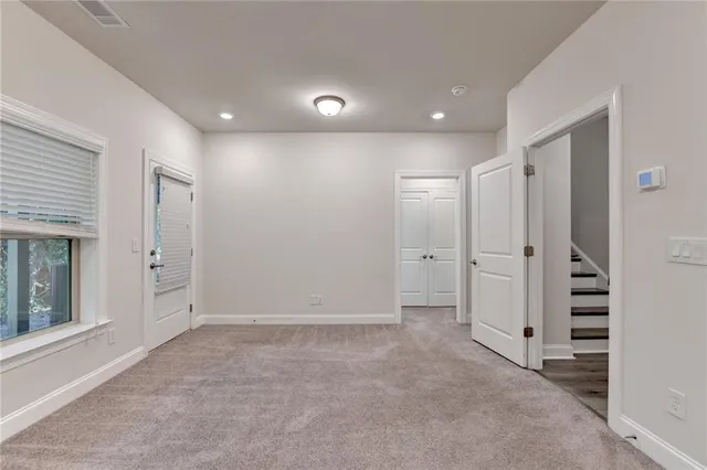 a balcony with wooden floor and fence