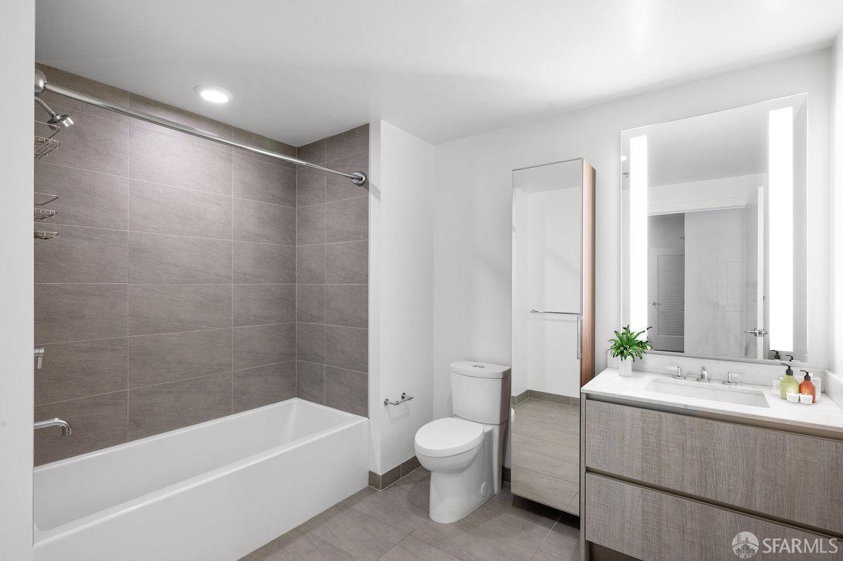 318 Main Street, Unit 4E San Francisco, CA 94105 - Photo 18 of 50 a bathroom with a bathtub shower sink vanity and toilet