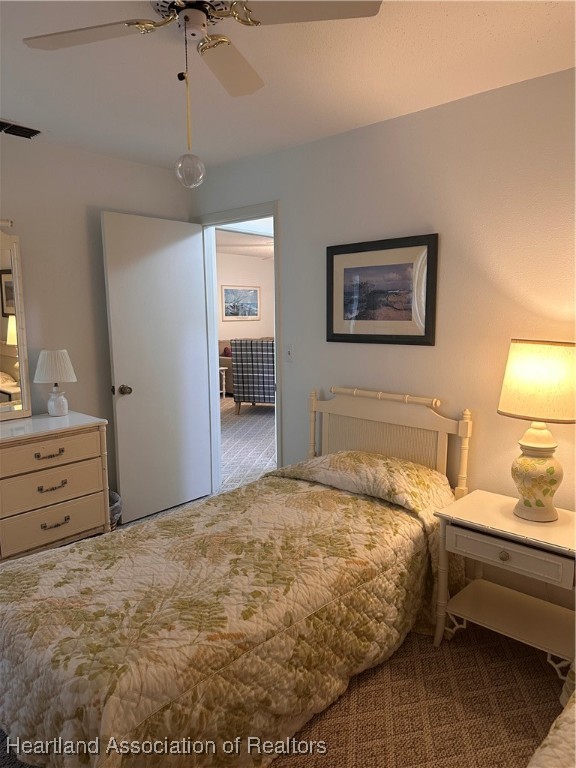 5007 Granada Boulevard Sebring, FL 33872 - Photo 11 of 15 a bedroom with a bed and a dresser