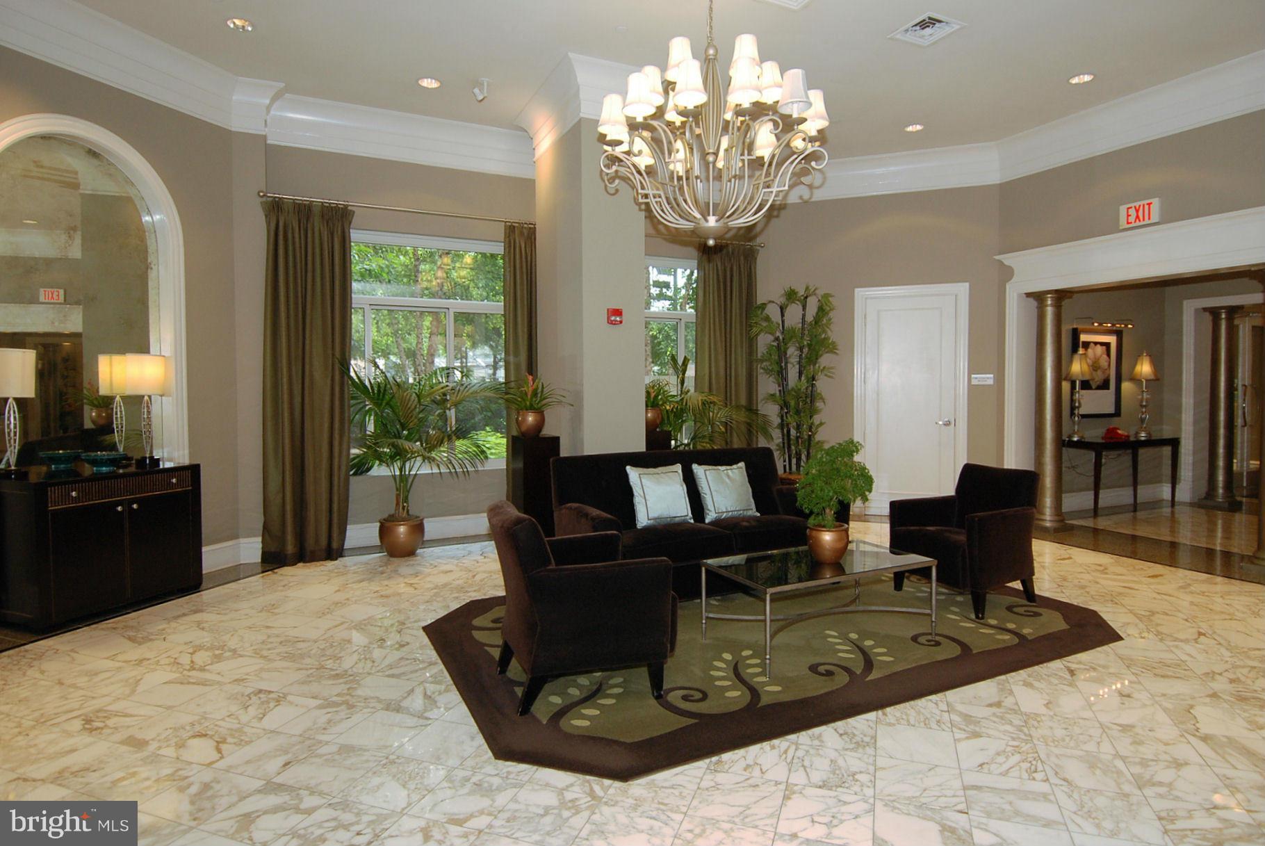 851 North Glebe Road, Unit 915 Arlington, VA 22203 - Photo 25 of 30 a living room with furniture and a chandelier