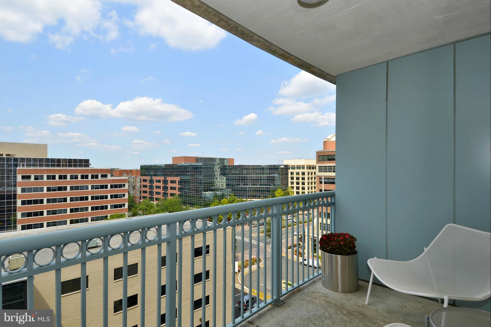 851 North Glebe Road, Unit 915 Arlington, VA 22203 - Photo 9 of 30 a view of a chair and table in the balcony