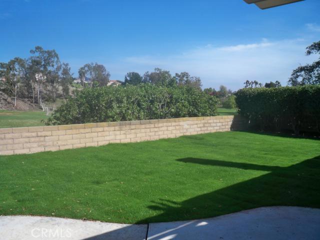 23892 Vía El Rocio Mission Viejo, CA 92691 - Photo 5 of 6 a view of yard with grass and trees