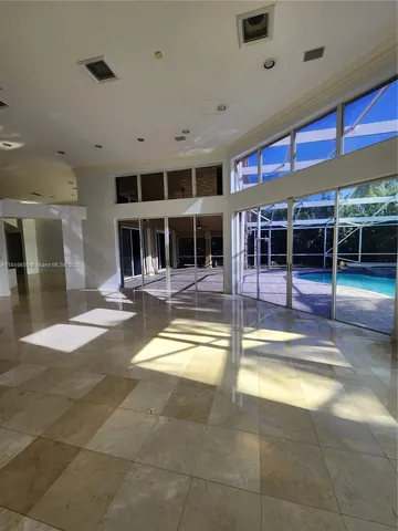 a kitchen with stainless steel appliances a sink stove and cabinets