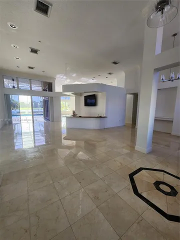 a lobby with furniture and window