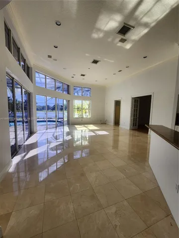 a view of entryway and hall with a sink
