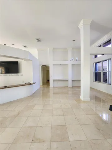 a view of living room with furniture and flat screen tv