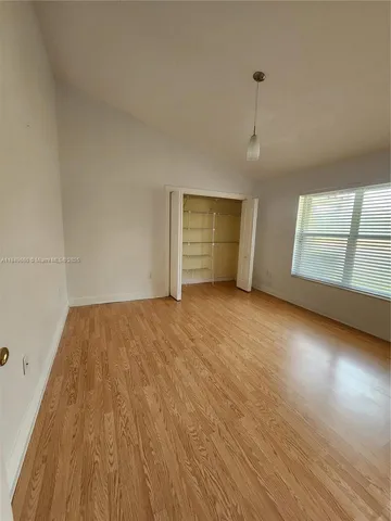 a view of wooden floor in an empty room