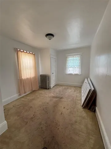 a view of empty room with windows