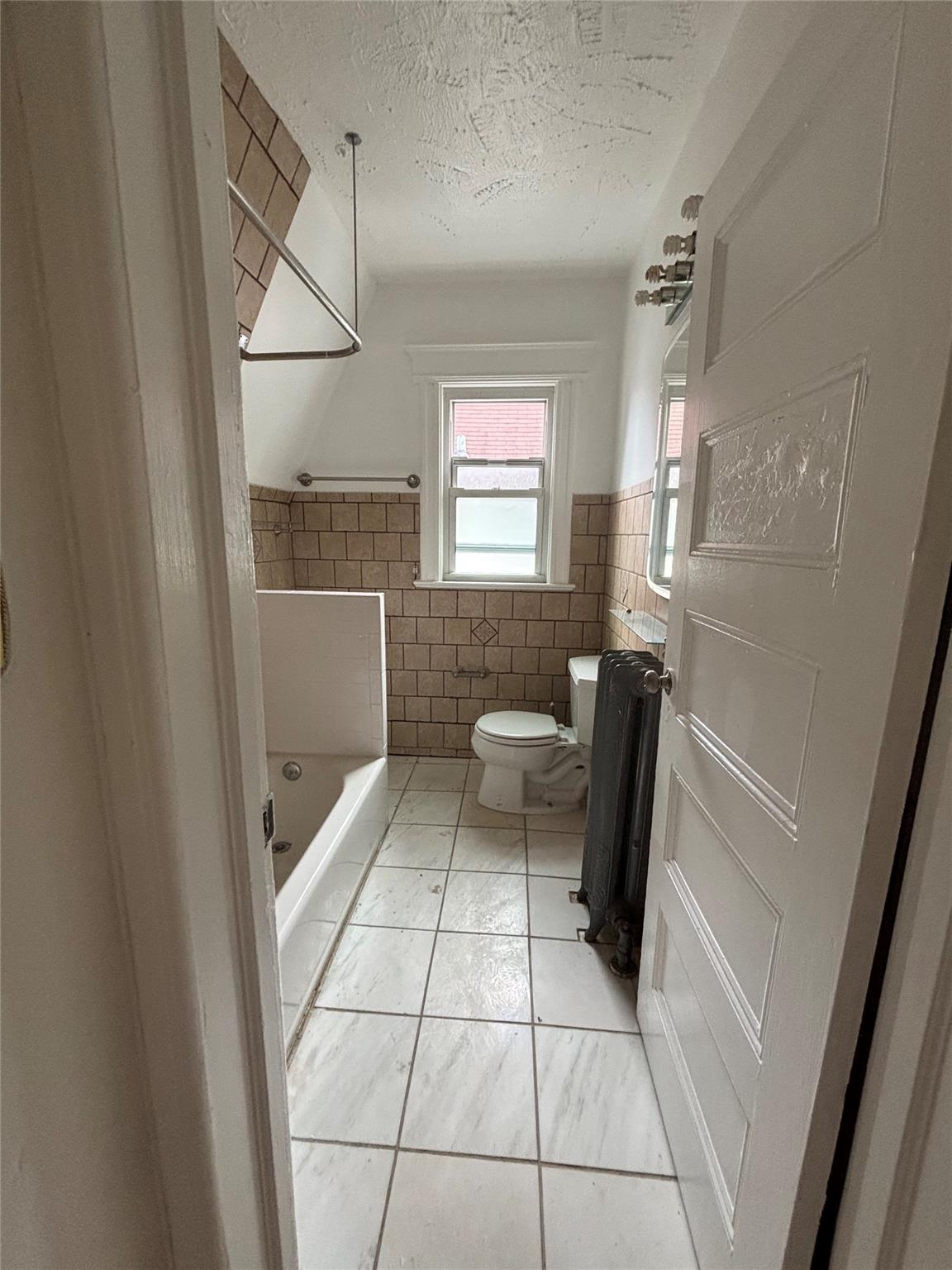 219-06 101st Avenue Queens, NY 11429 - Photo 18 of 19 a bathroom with a sink toilet and shower