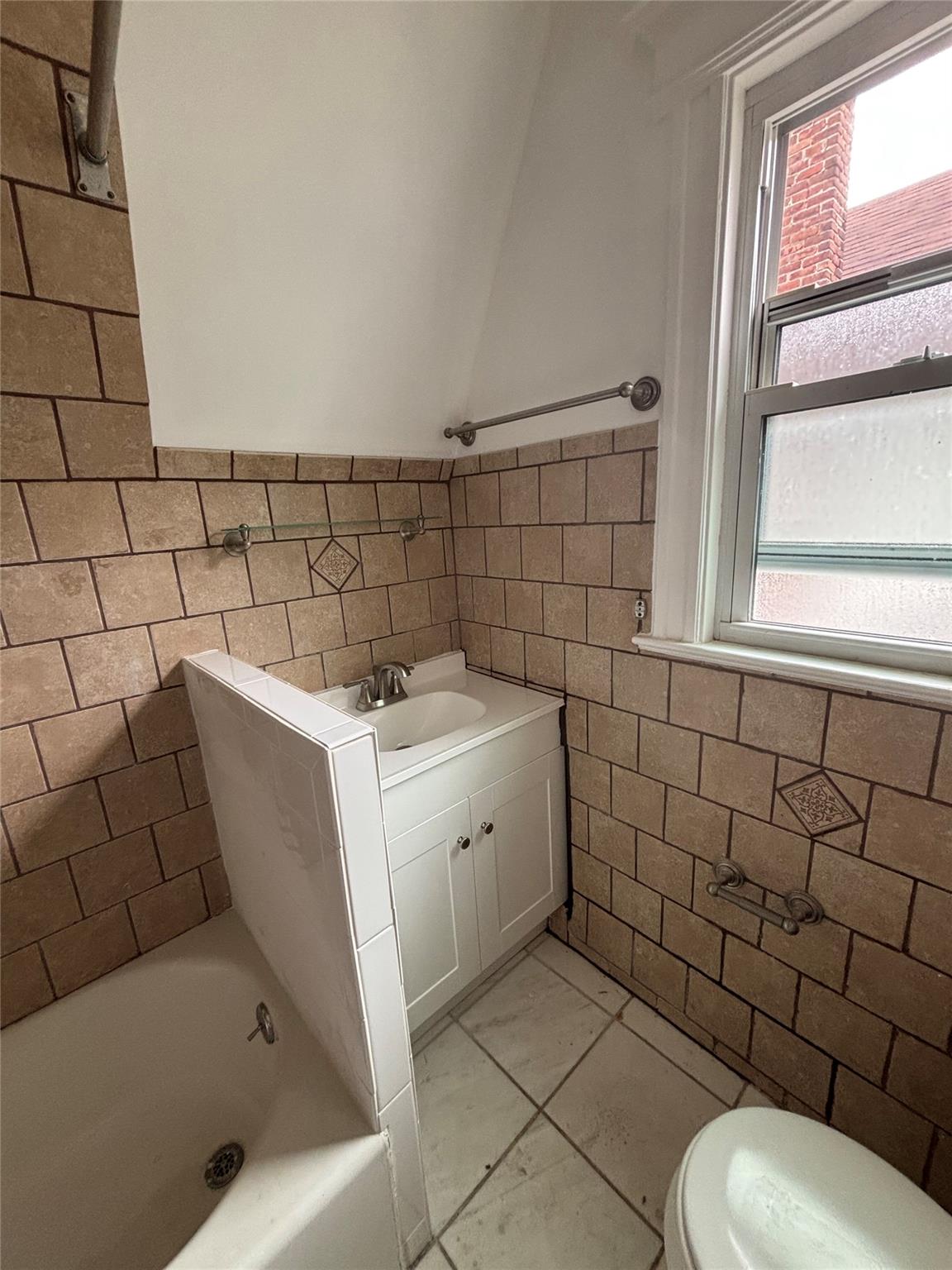 219-06 101st Avenue Queens, NY 11429 - Photo 19 of 19 a bathroom with a sink toilet and shower