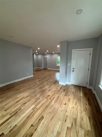 a view of an empty room and glass door