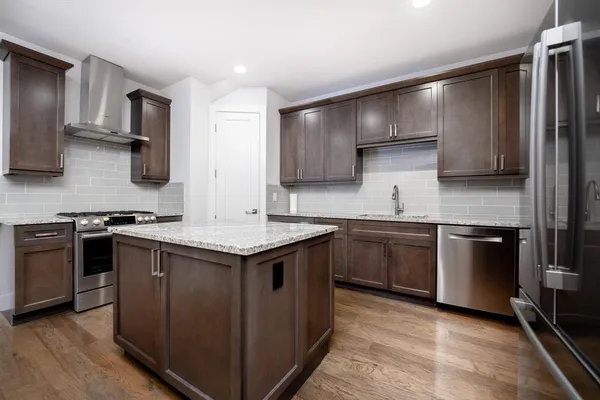 a kitchen with a stove and a sink