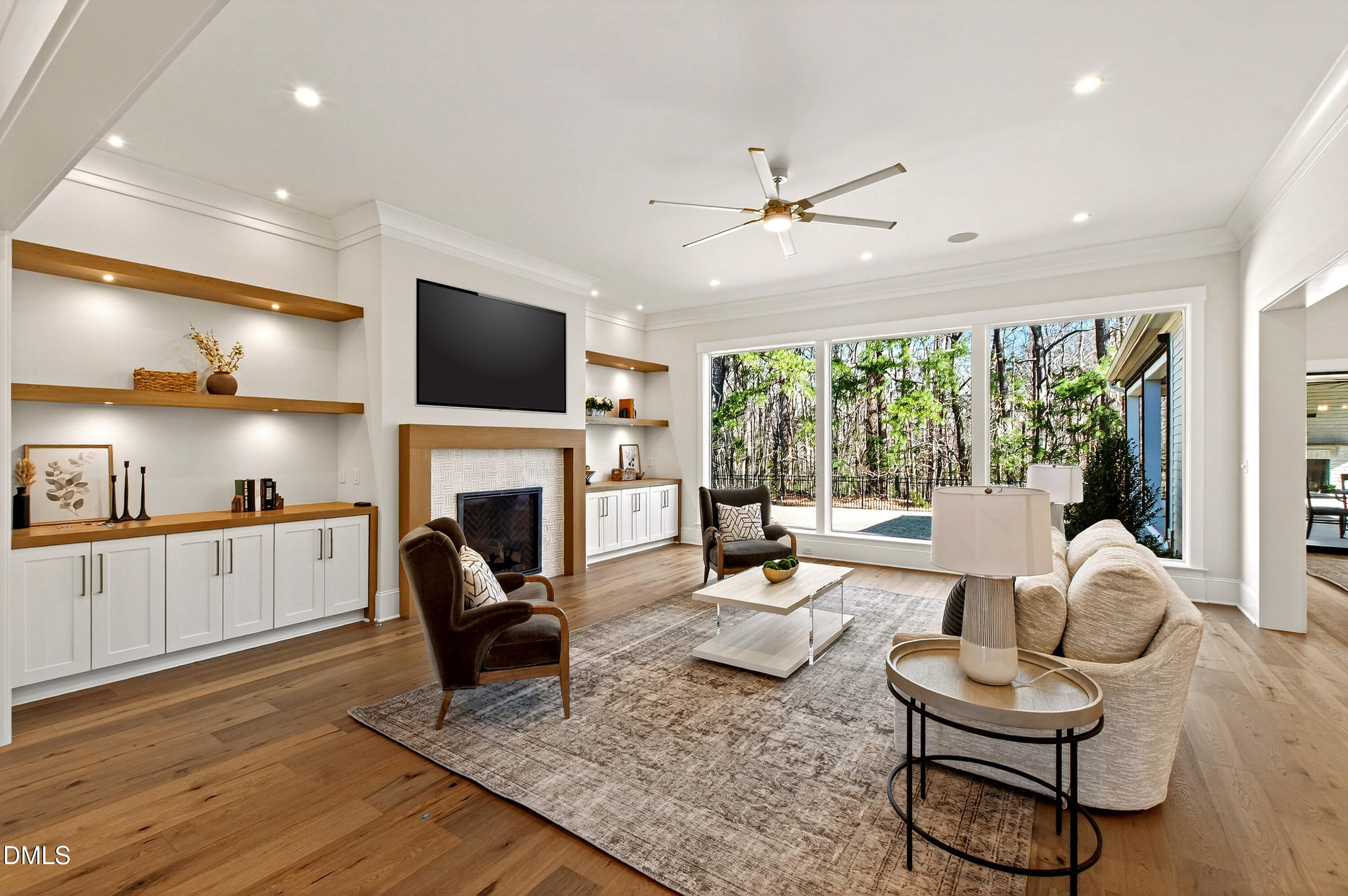 a living room with furniture a fireplace and a flat screen tv