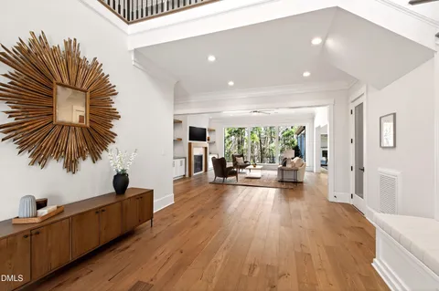 a living room with furniture fireplace and window