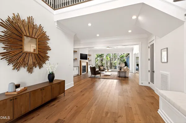 a living room with furniture fireplace and window