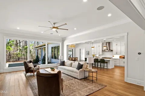 a kitchen with cabinets stainless steel appliances a sink and wooden floor