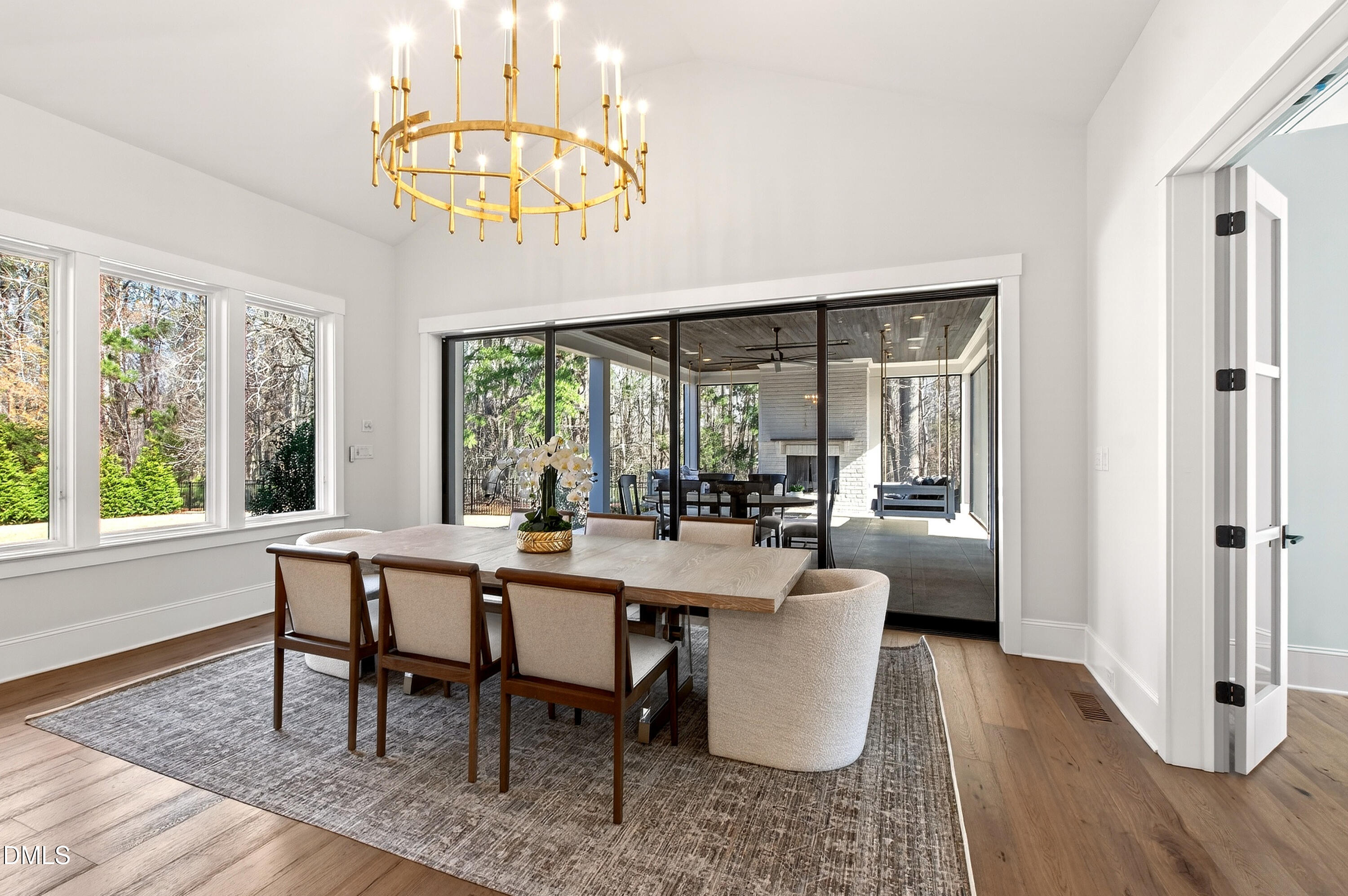 1608 Estate Valley Lane Raleigh, NC 27613 - Photo 3 of 99 a view of a dining room with furniture a chandelier and wooden floor
