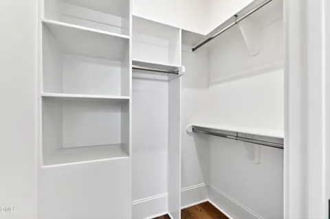 a bathroom with a shower and a gate