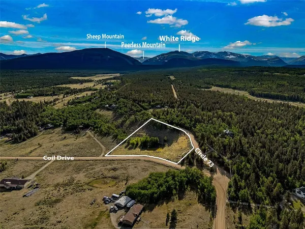 a aerial view of a house with a yard