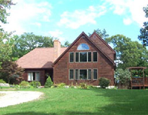 630 Barrack Hill Road Ridgefield, CT 06877 - Photo 1 of 1 a front view of a house with a garden