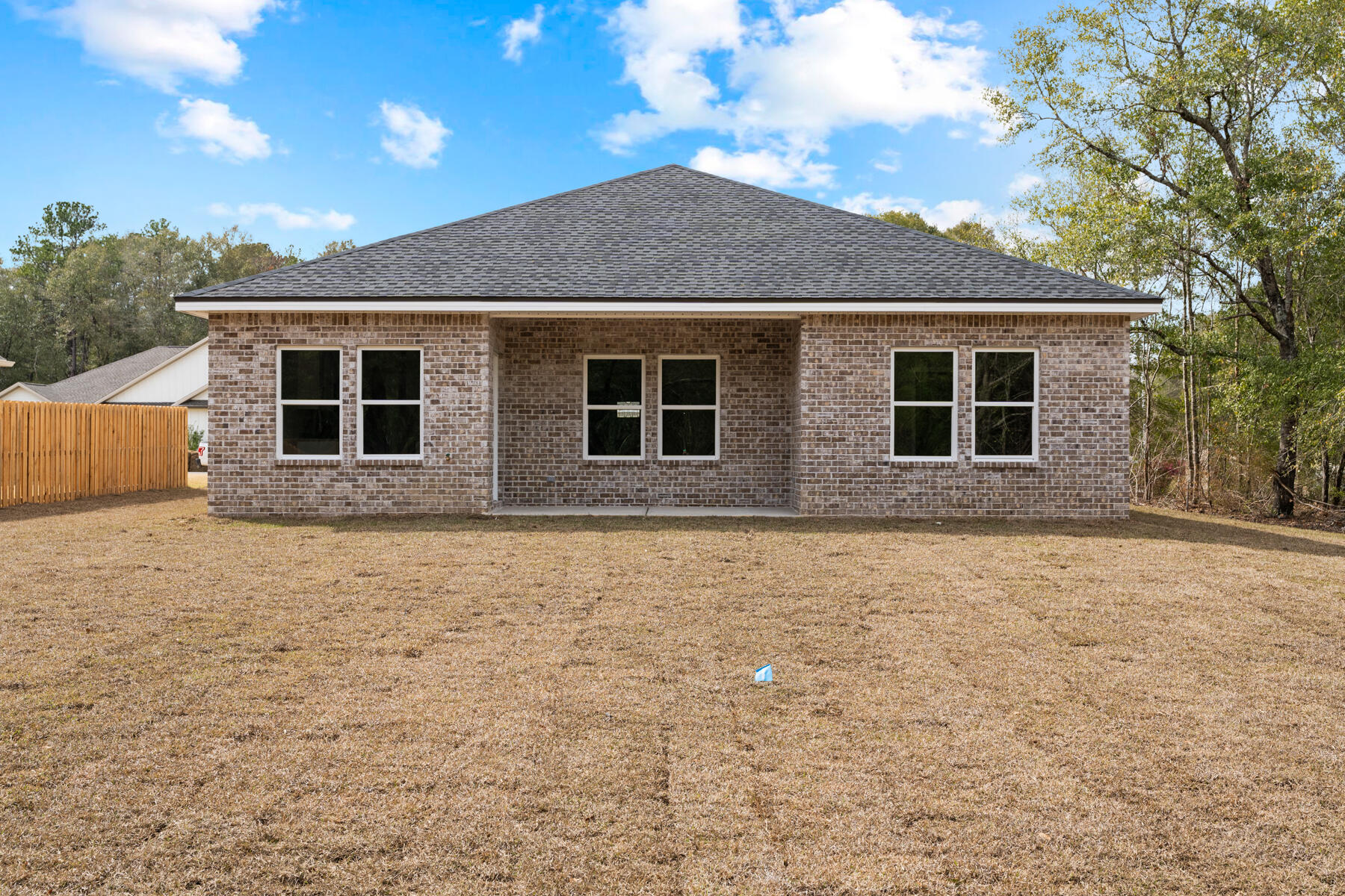 5331 Old River Road Baker, FL 32531 - Photo 12 of 13 a house with trees in the background