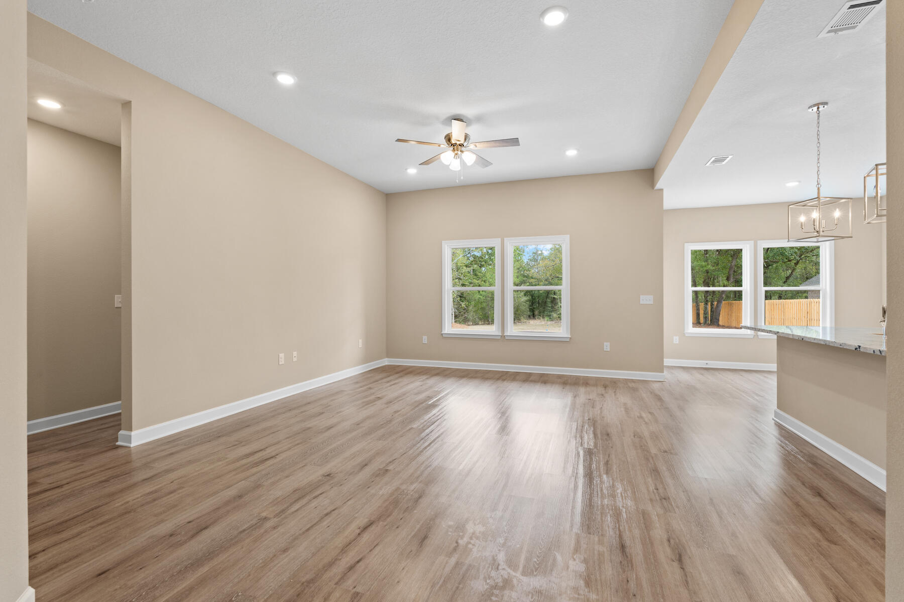 5331 Old River Road Baker, FL 32531 - Photo 3 of 13 wooden floor in an empty room with a window
