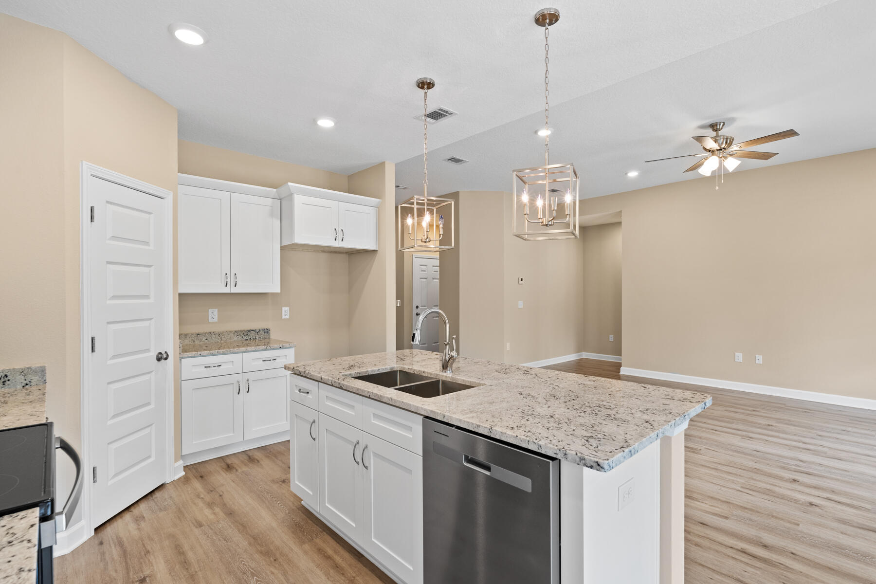 5331 Old River Road Baker, FL 32531 - Photo 7 of 13 a kitchen that has a lot of cabinets and wooden floor