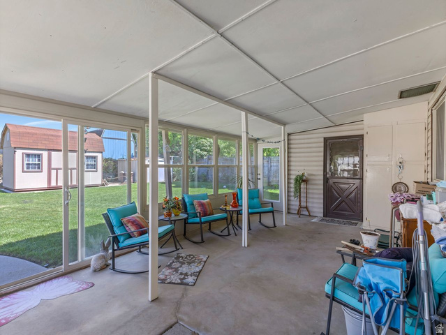 1502 North 475 West Sunset, UT 84015 - Photo 16 of 23 Screened patio with concrete flooring