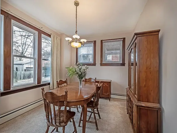 a view of a dining room with furniture window and outside view