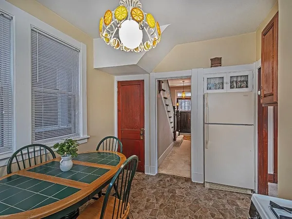 a view of kitchen and dining area with furniture