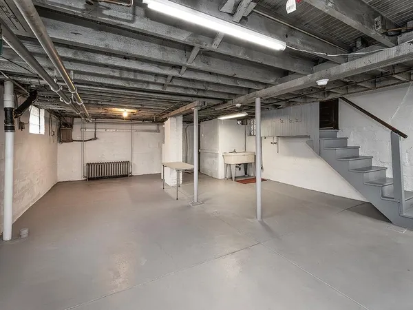 a view of empty room with wooden ceiling