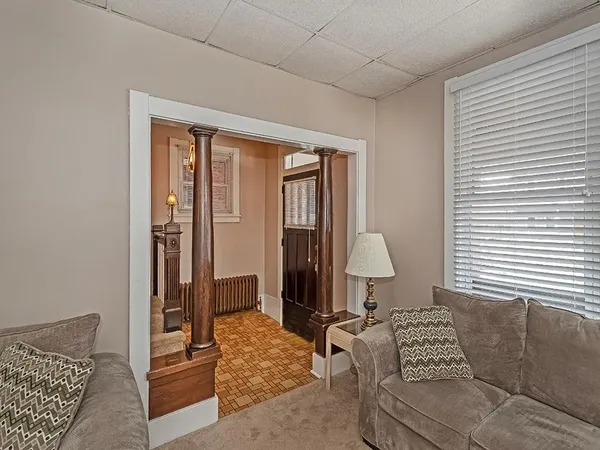 a living room with furniture and a window