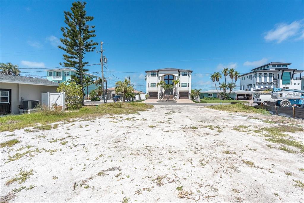 575 Crystal Drive Madeira Beach, FL 33708 - Photo 11 of 16 a front view of a house with a yard