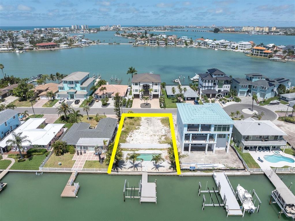 575 Crystal Drive Madeira Beach, FL 33708 - Photo 5 of 16 an aerial view of a swimming pool with a table and chairs