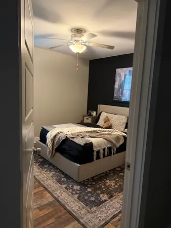 a bedroom with a bed and a television