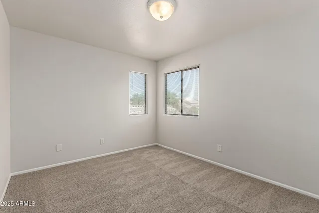 an empty room with windows and a window